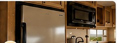 RV kitchen appliances including refrigerator and microwave